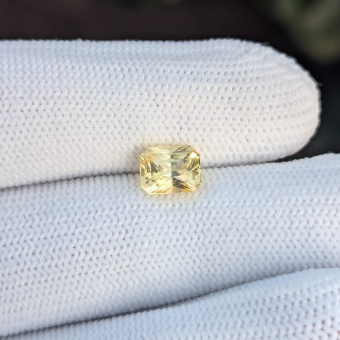 Yellow sapphire on white glove